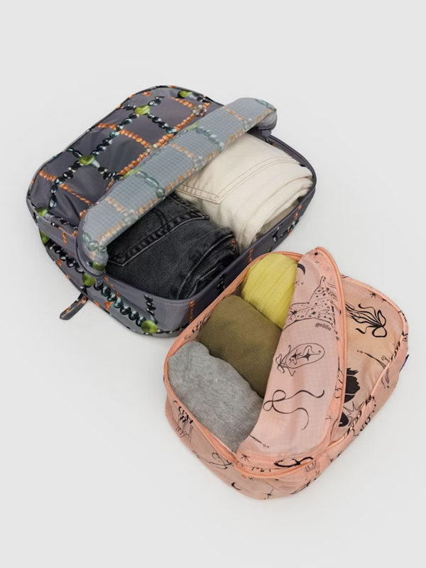 Baggu Packing Cube Set, a set of lightweight, durable cubes designed to help organize and pack your clothes and accessories efficiently for travel.