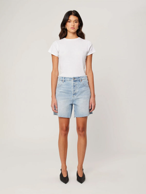 90s-inspired relaxed-fit shorts in a light vintage blue color, featuring a casual, comfortable design perfect for warm weather and styled with a retro vibe.