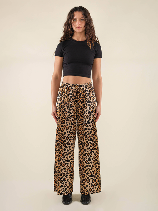 Leopard print satin pants with a straight leg fit, offering a bold and stylish look with a smooth, shiny finish, perfect for adding a touch of edge to your wardrobe.