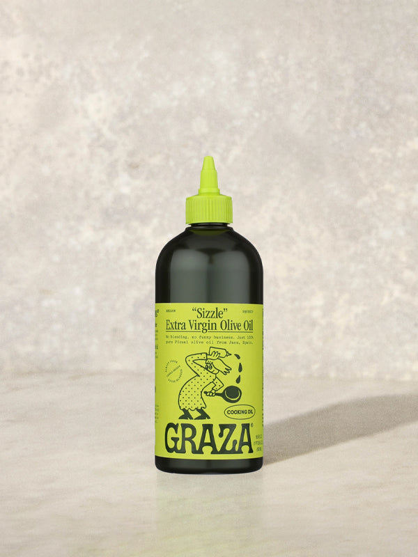 Graza olive oil, a premium, cold-pressed olive oil with a rich, robust flavor, perfect for drizzling over dishes, cooking, or enhancing your favorite recipes.