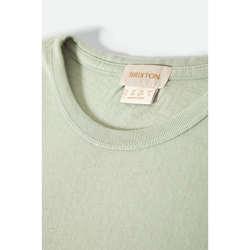 A soft and breathable Carefree Tank in sage green, made from lightweight fabric. The tank features a relaxed, sleeveless design with a minimalist look, offering a comfortable, effortless style that's perfect for casual wear or layering.