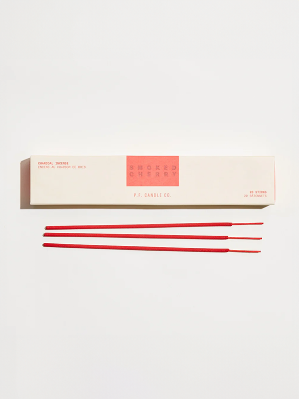 A set of incense sticks with a rich smoked cherry scent. The sticks emit a warm, sweet fragrance with smoky undertones when burned, creating a cozy and aromatic atmosphere perfect for relaxation or meditation.