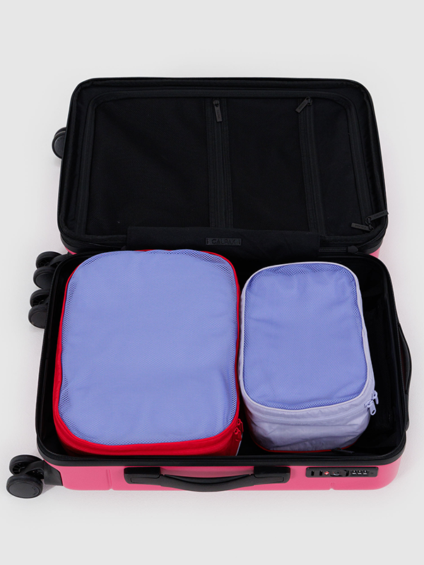 Baggu Packing Cube Set, a set of lightweight, durable cubes designed to help organize and pack your clothes and accessories efficiently for travel.