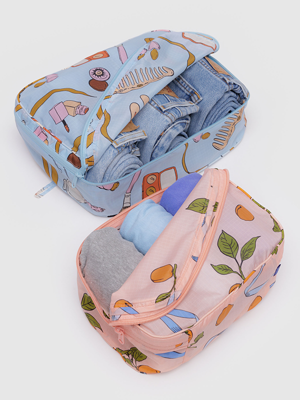 Baggu Packing Cube Set, a set of lightweight, durable cubes designed to help organize and pack your clothes and accessories efficiently for travel.