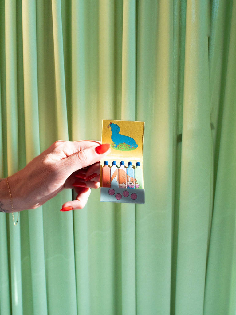 Dog Matchbook – A playful and charming matchbook featuring a fun dog design, perfect for lighting candles or adding a touch of whimsy to your space.