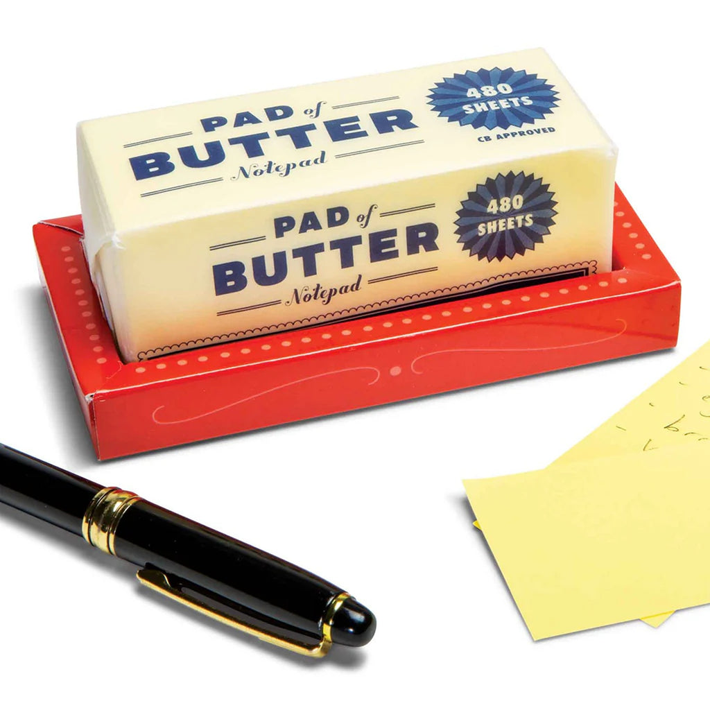 A whimsical notepad shaped like a pad of butter, featuring a yellow, buttery design. The pages are smooth and perfect for jotting down notes, with the playful design adding a touch of fun to your desk or workspace.