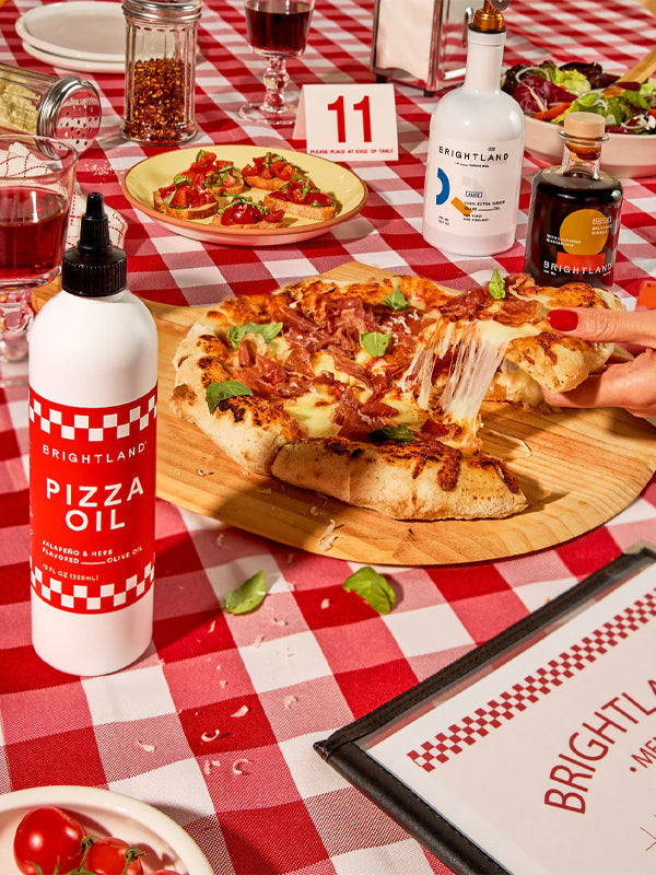 Pizza oil infused with herbs and spices, perfect for drizzling on pizza, pasta, or other dishes for an extra burst of savory flavor.