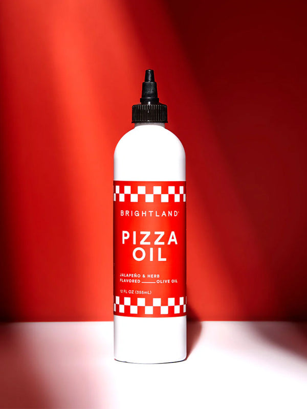 Pizza oil infused with herbs and spices, perfect for drizzling on pizza, pasta, or other dishes for an extra burst of savory flavor.