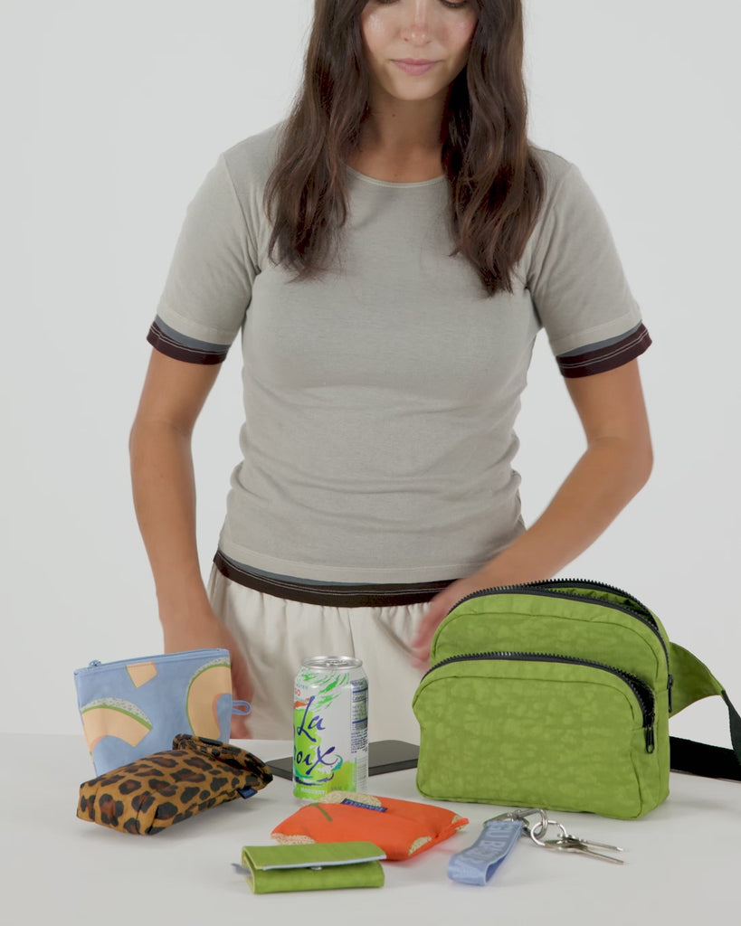 Baggu Fanny Pack, a compact and functional waist bag with an adjustable strap, perfect for hands-free carrying of essentials in a stylish, practical design.