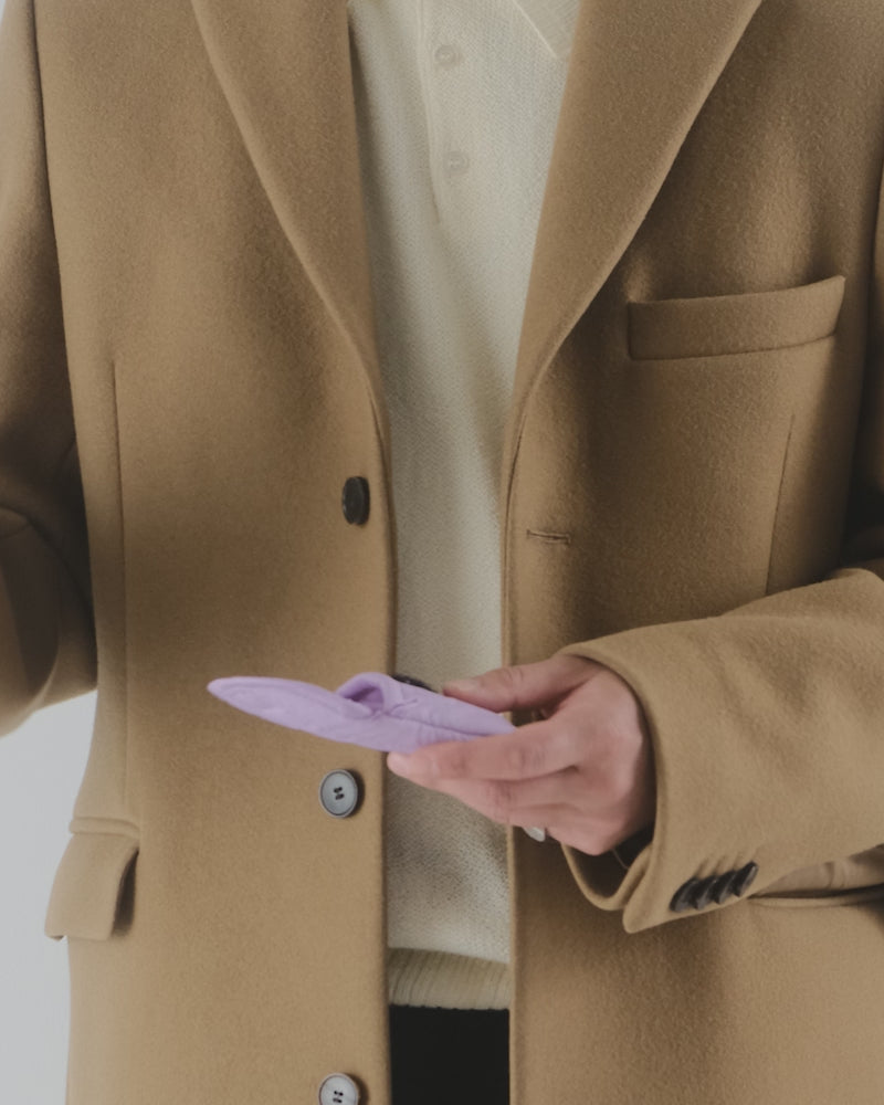 Baggu Puffy Earbuds Case, a soft, quilted case designed to protect your earbuds, featuring a stylish and compact design for easy storage and portability.