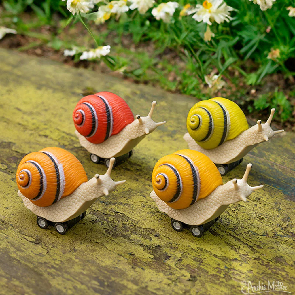 Racing snail figures featuring cute, whimsical snails in dynamic racing poses, perfect for playful decoration or imaginative play.