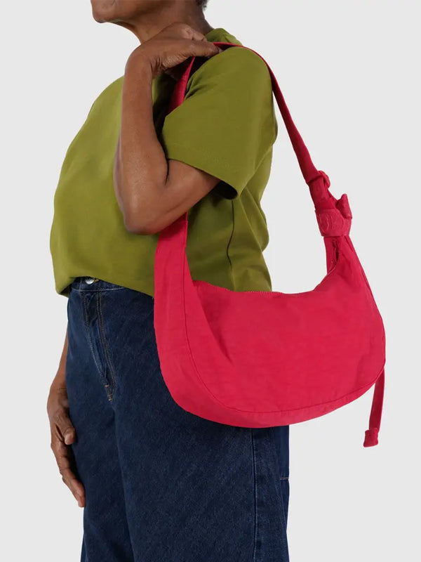 Medium Crescent Baggu, a sleek and stylish bag with a curved shape, offering a perfect balance of size and functionality for everyday use.