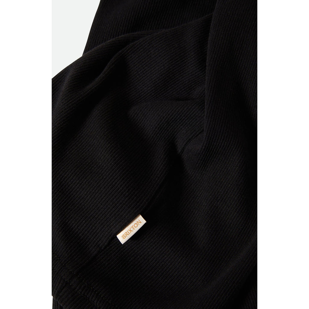 A stylish Ringer Organic A-Tank in black with off-white trim. The tank features a soft, organic cotton fabric with a classic ringer design, offering a comfortable, relaxed fit perfect for casual wear.