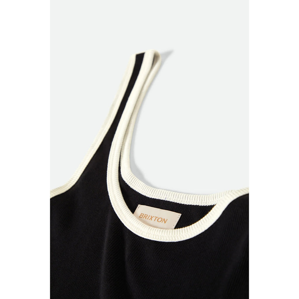 A stylish Ringer Organic A-Tank in black with off-white trim. The tank features a soft, organic cotton fabric with a classic ringer design, offering a comfortable, relaxed fit perfect for casual wear.