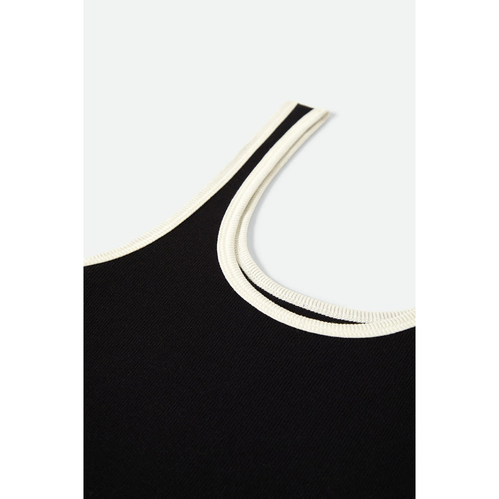 A stylish Ringer Organic A-Tank in black with off-white trim. The tank features a soft, organic cotton fabric with a classic ringer design, offering a comfortable, relaxed fit perfect for casual wear.