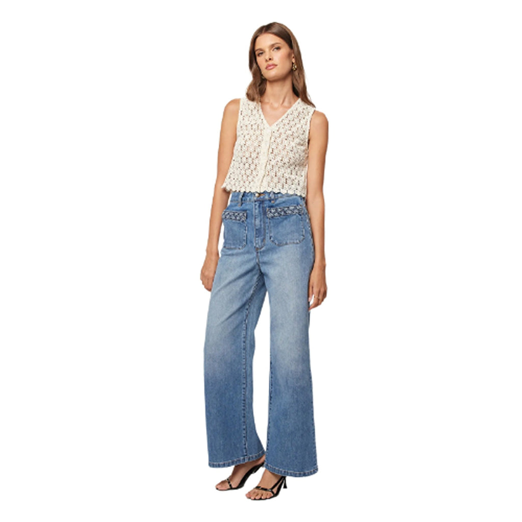 High-waisted sailor jeans in a canyon blue wash, featuring a flattering, wide-leg fit with button details on the front for a nautical-inspired, vintage look.