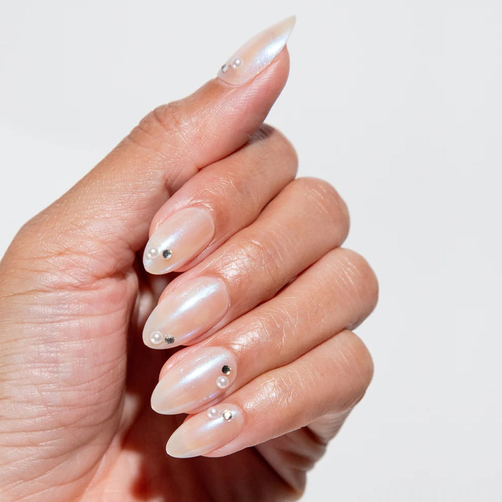 A set of press-on nails named Glass Castle, featuring a shimmering, translucent design with delicate details that evoke a magical, ethereal look. The nails are easy to apply, offering a stylish and long-lasting manicure without the need for professional tools.