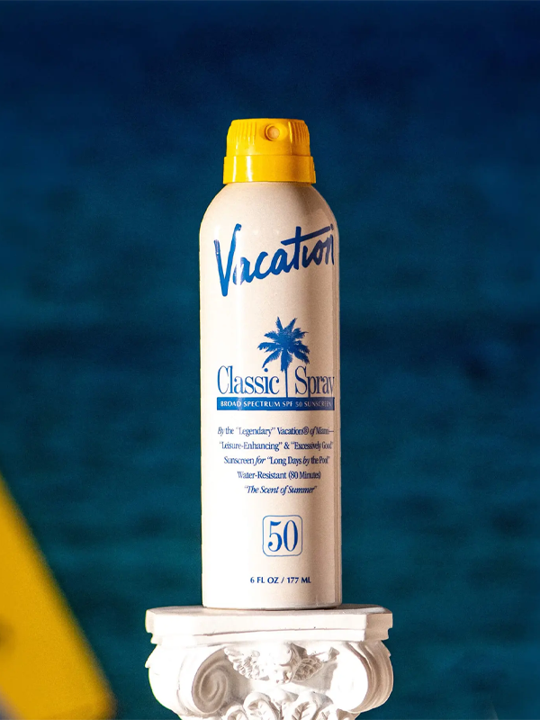 Vacation® Classic Spray SPF 50, offering broad-spectrum sun protection with a lightweight, water-resistant formula for a sun-safe and smooth finish.